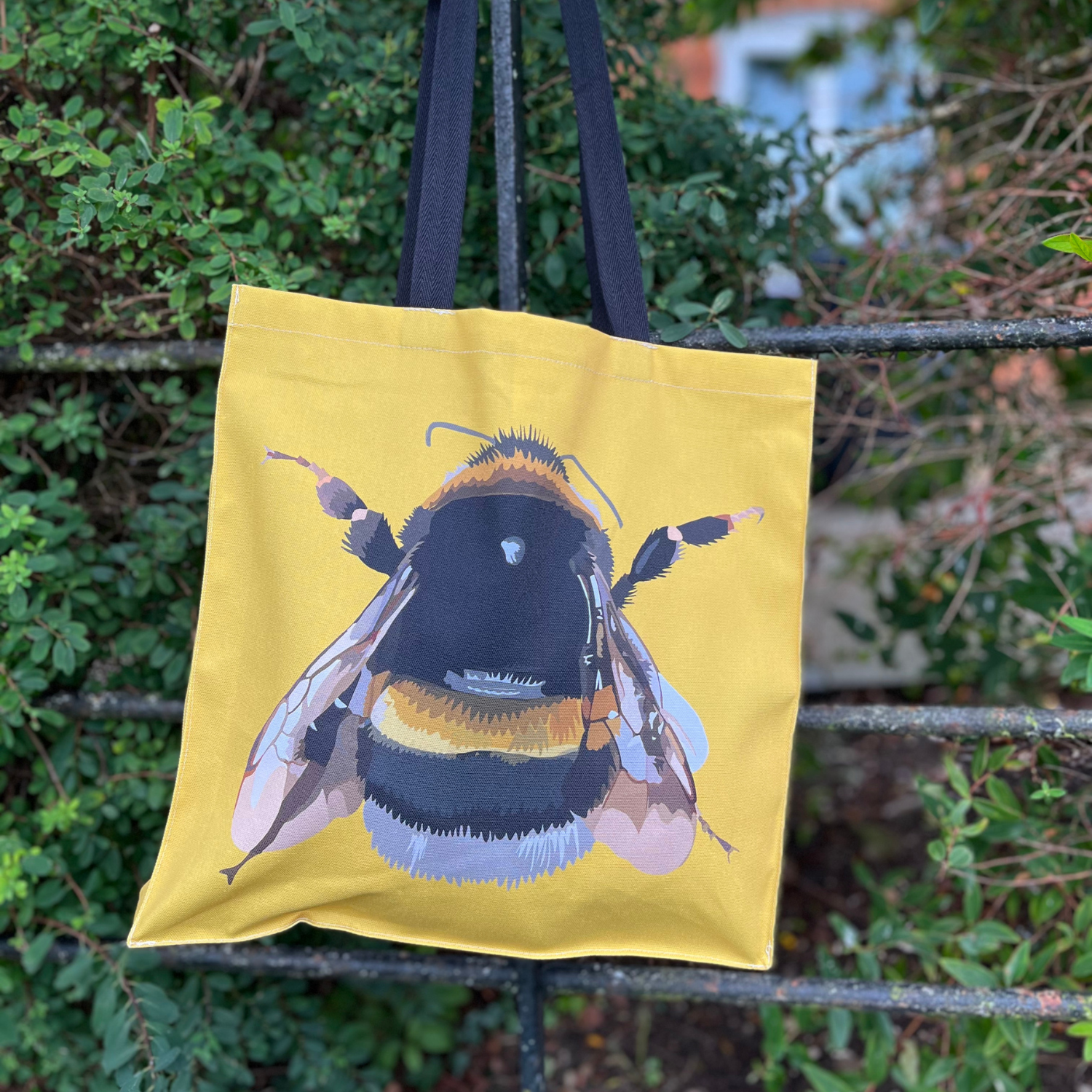 Bee tote bag with hand-illustrated bee on yellow background
