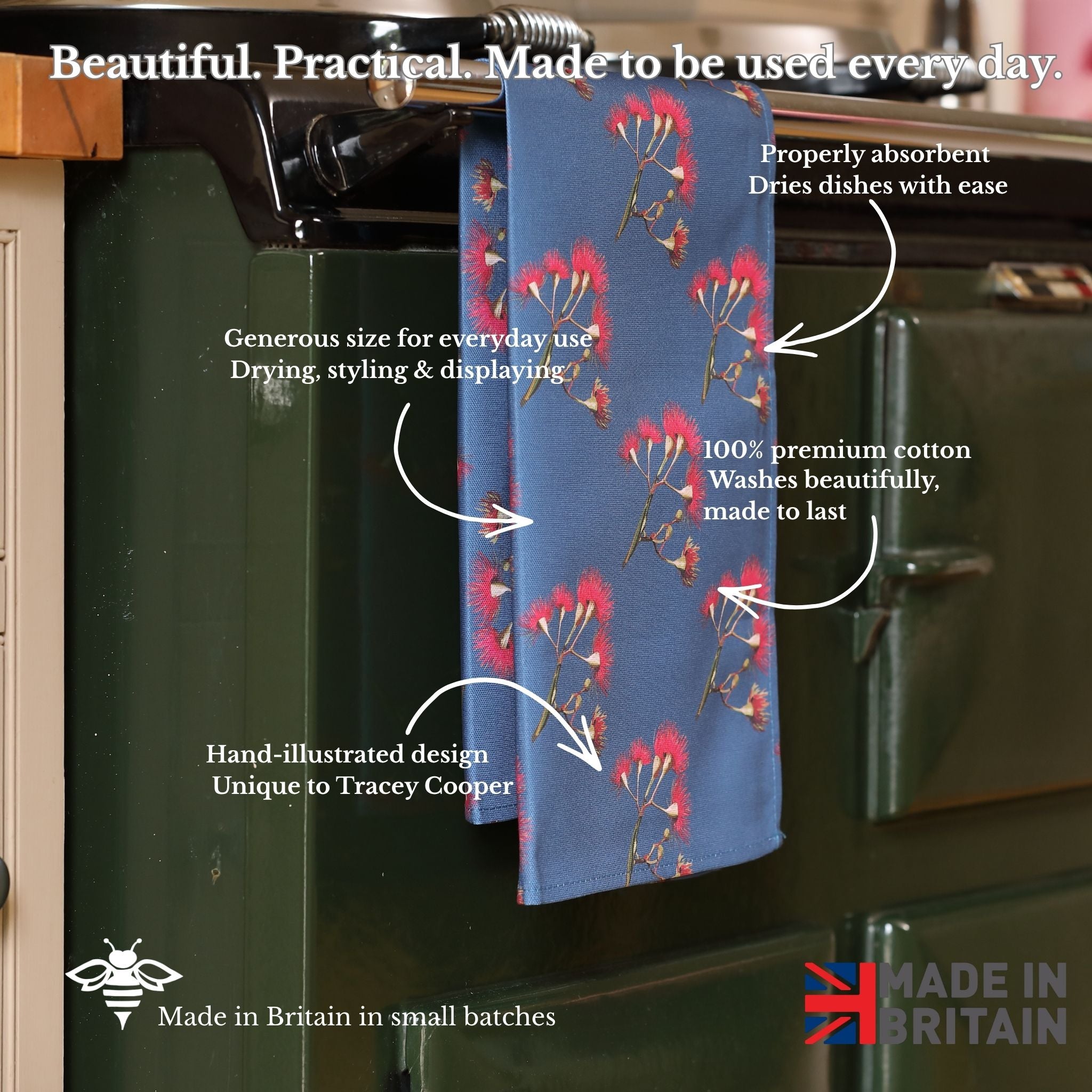Blue floral towel hanging on a kitchen rack with text describing its features.