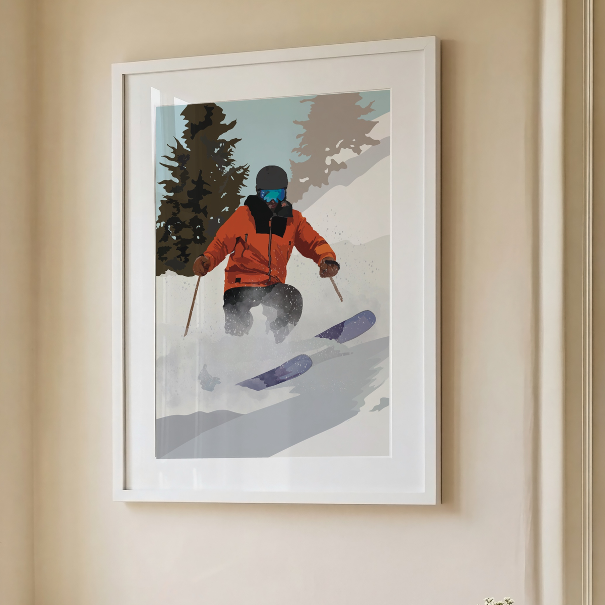 A framed art print depicting a skier in an orange jacket on a snowy mountain path, hung on a beige wall.