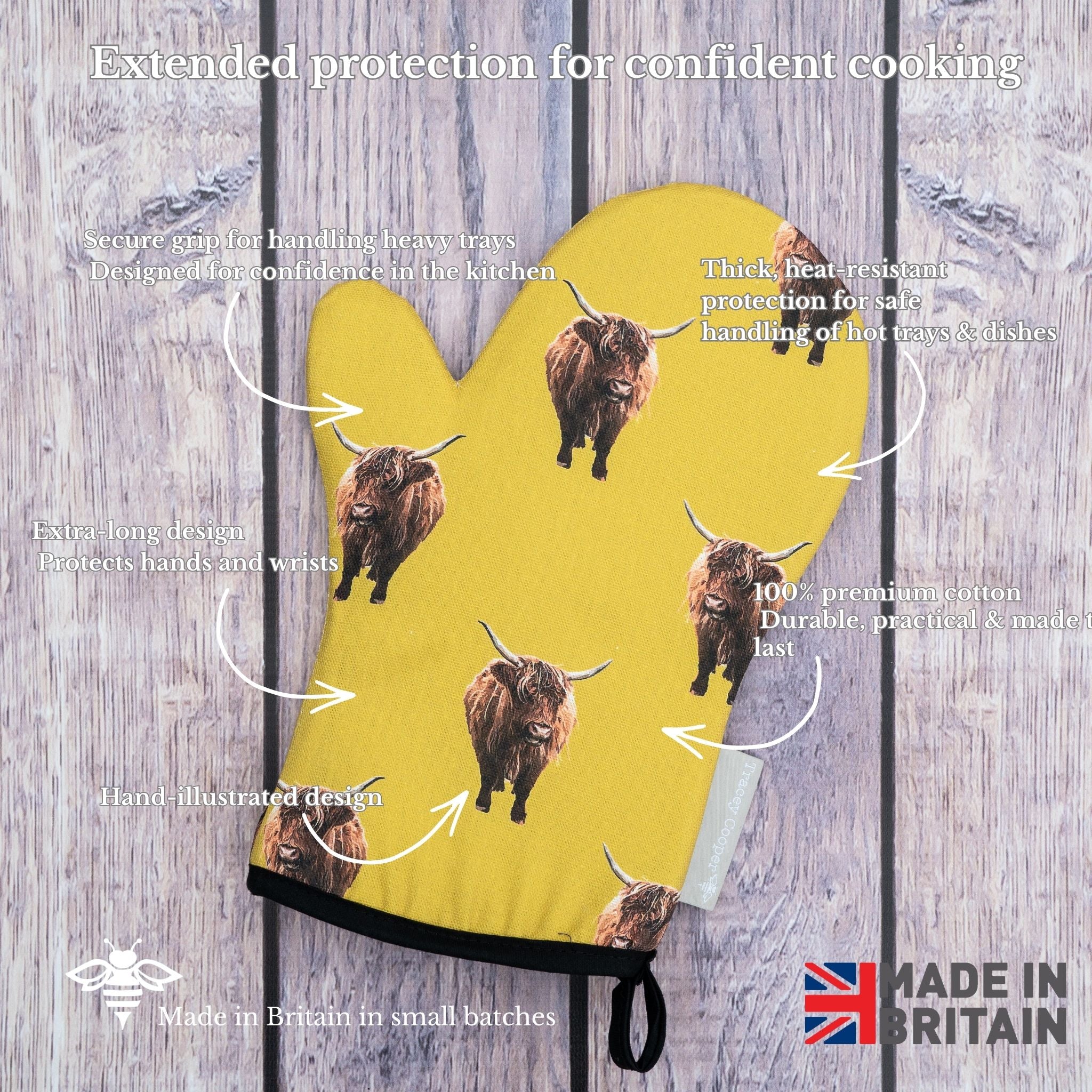 Yellow oven mitt with highland cow pattern on a wooden background, featuring text about product features.