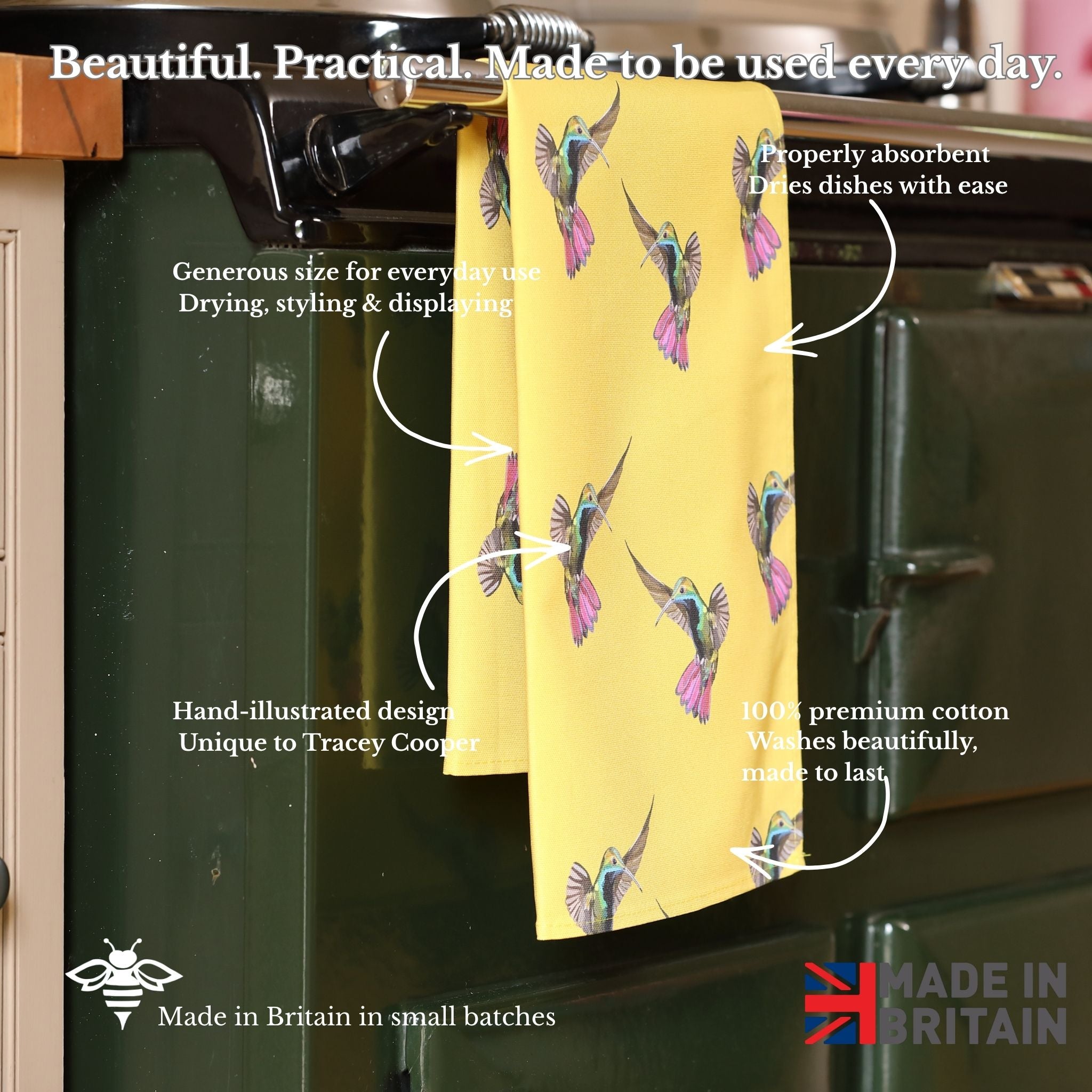 Yellow towel with bird pattern hanging on a rack, with text describing its features.