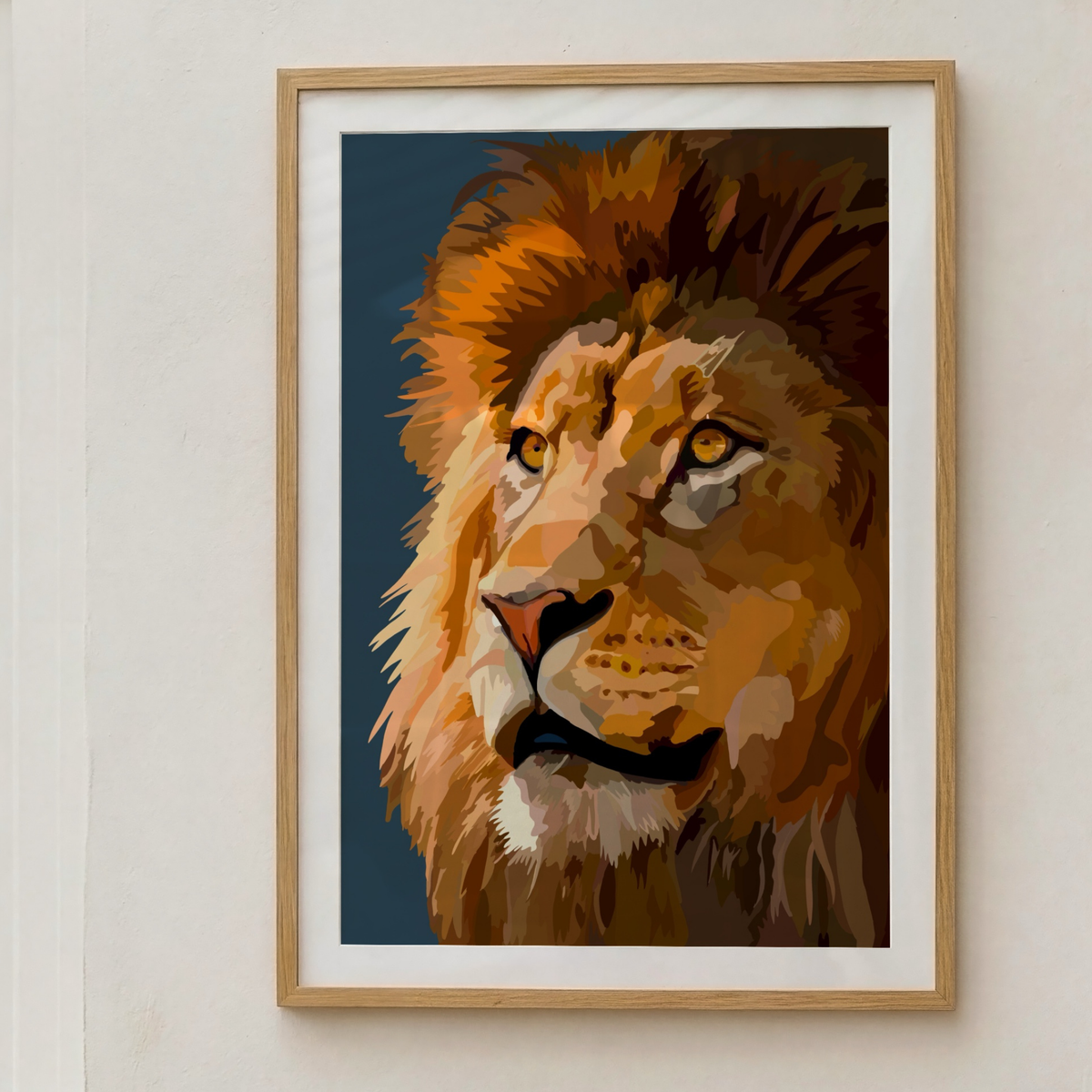 A framed art print featuring a stylized, textured digital painting of a lion's face in profile, set against a dark blue background. The print is housed in a light oak wood frame with a white mat, mounted on a neutral off-white wall.