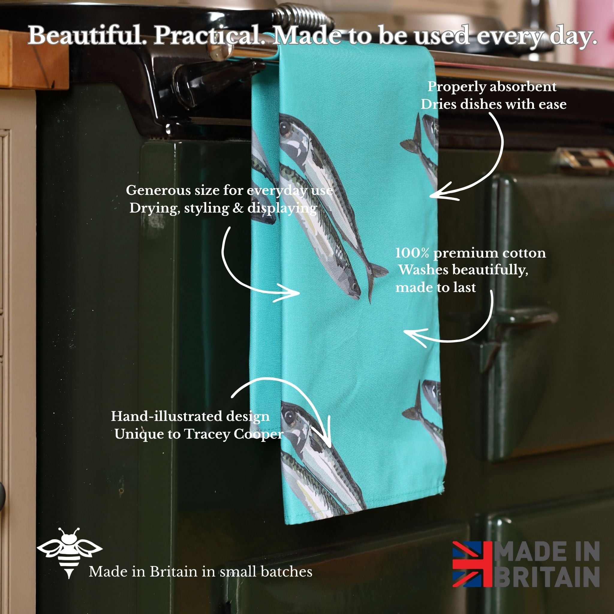 Teal towel with mackerel design hanging on a rack, with text describing its features.