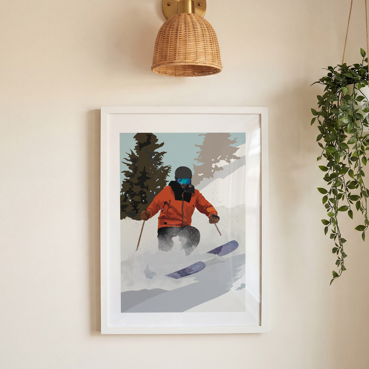 A framed art print of a skier in a snowy landscape, hanging on a beige wall below a woven wall lamp and next to a hanging green plant.