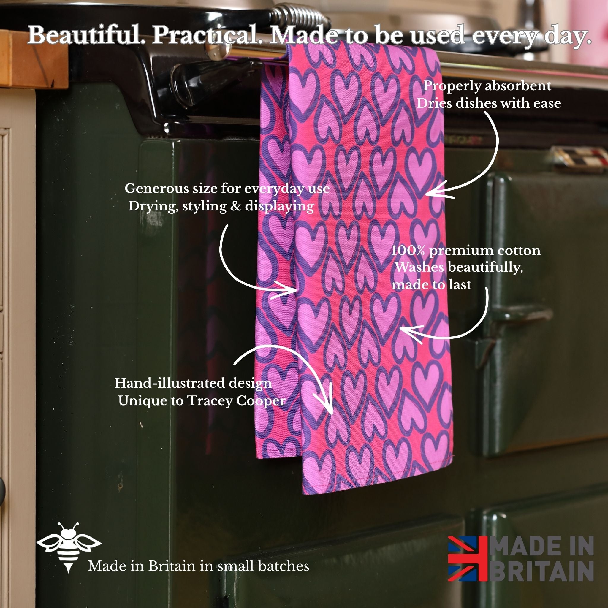 Heart-patterned towel hanging on a kitchen rack with text describing its features.