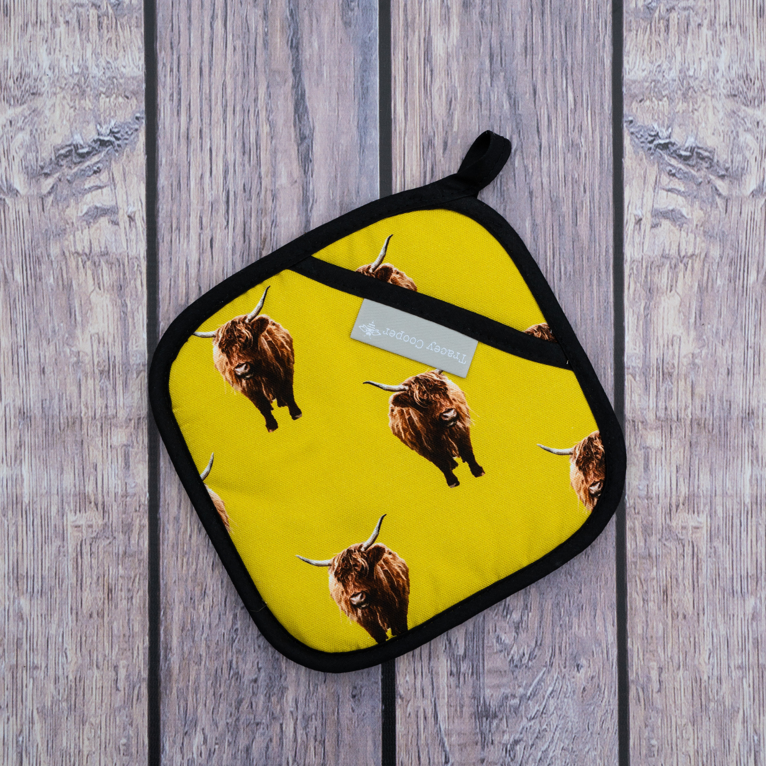 Hand illustrated highland cow pot grab yellow background