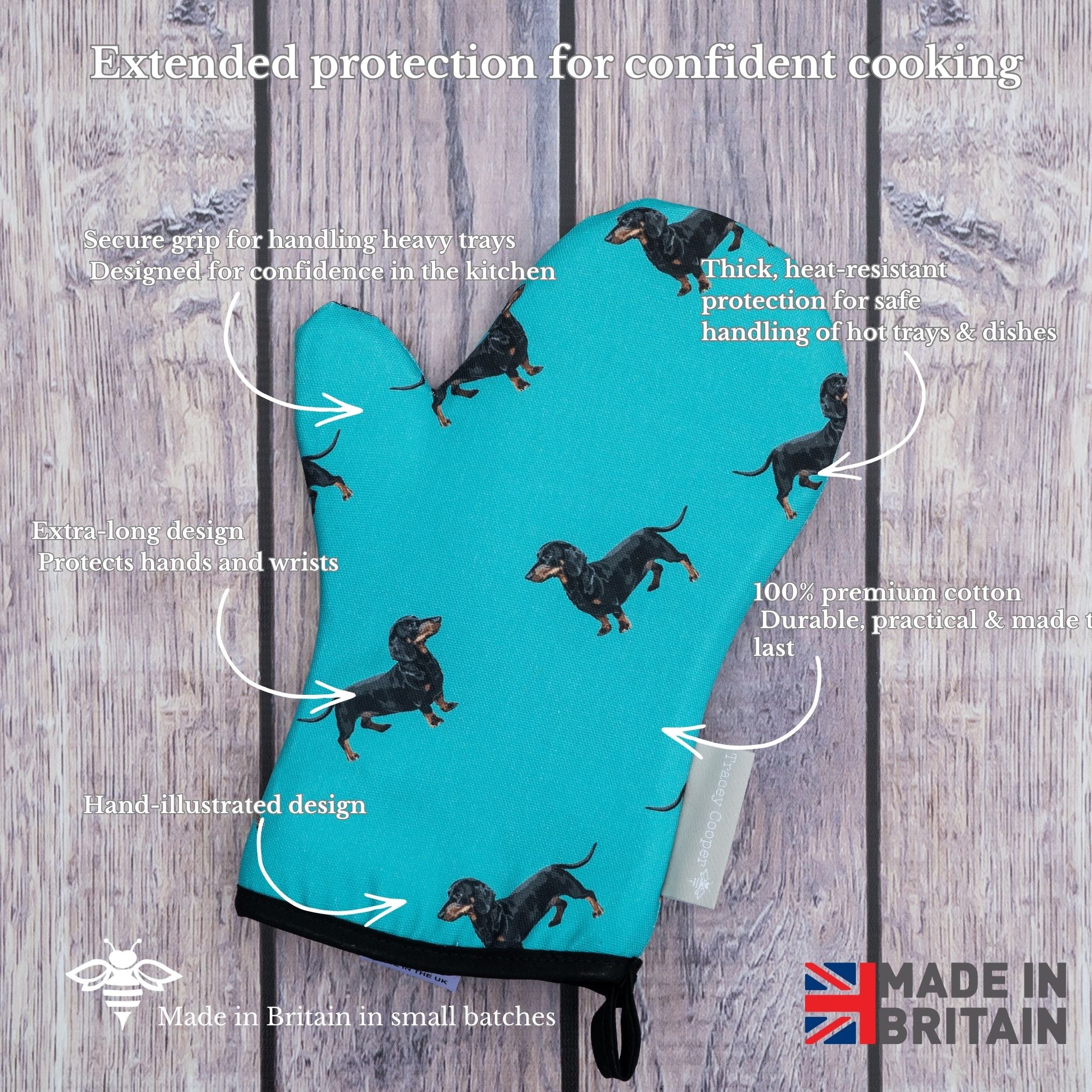 Teal oven mitt with dachshund pattern on a wooden background, featuring text about product features.