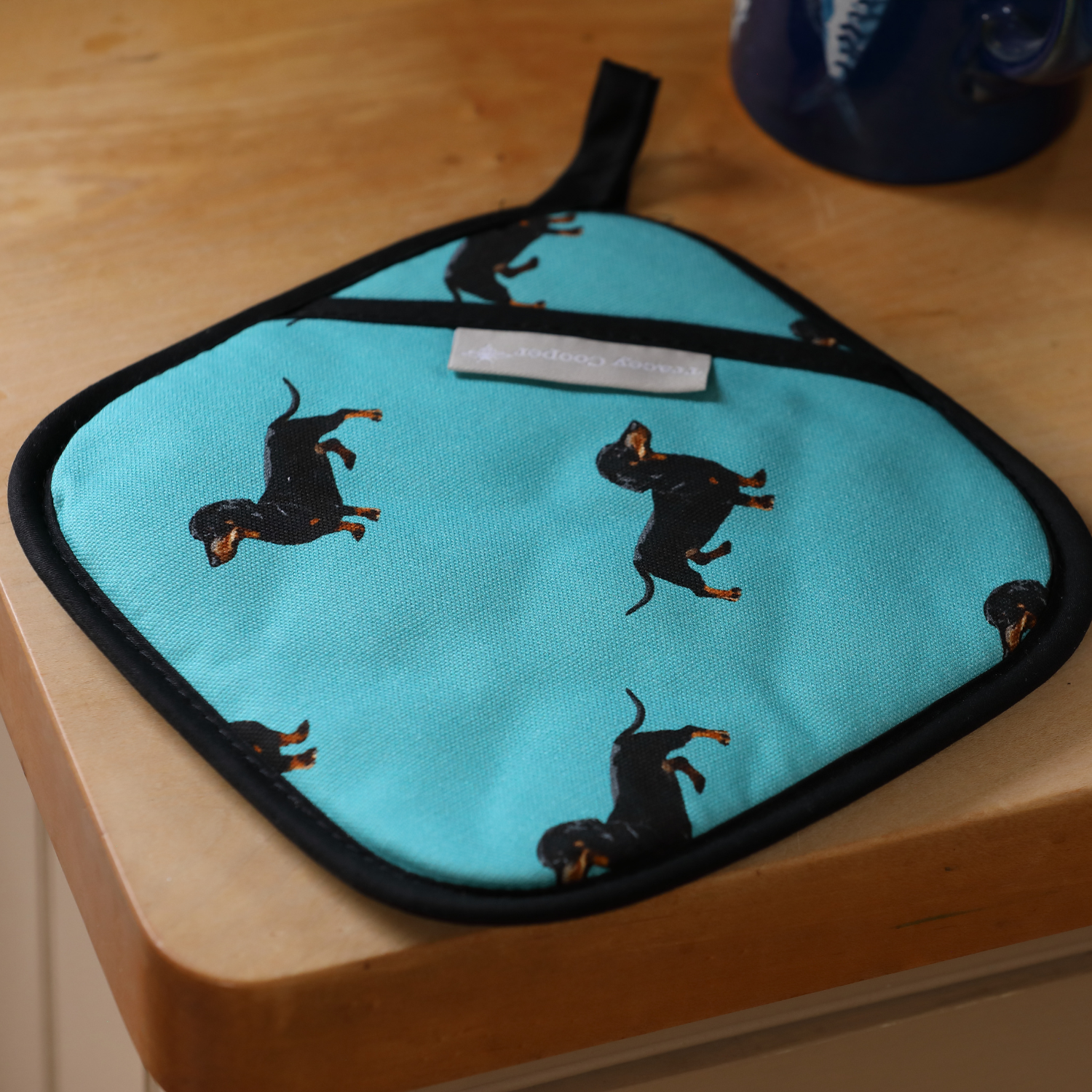 Sausage dog pot grab teal British made kitchen linen