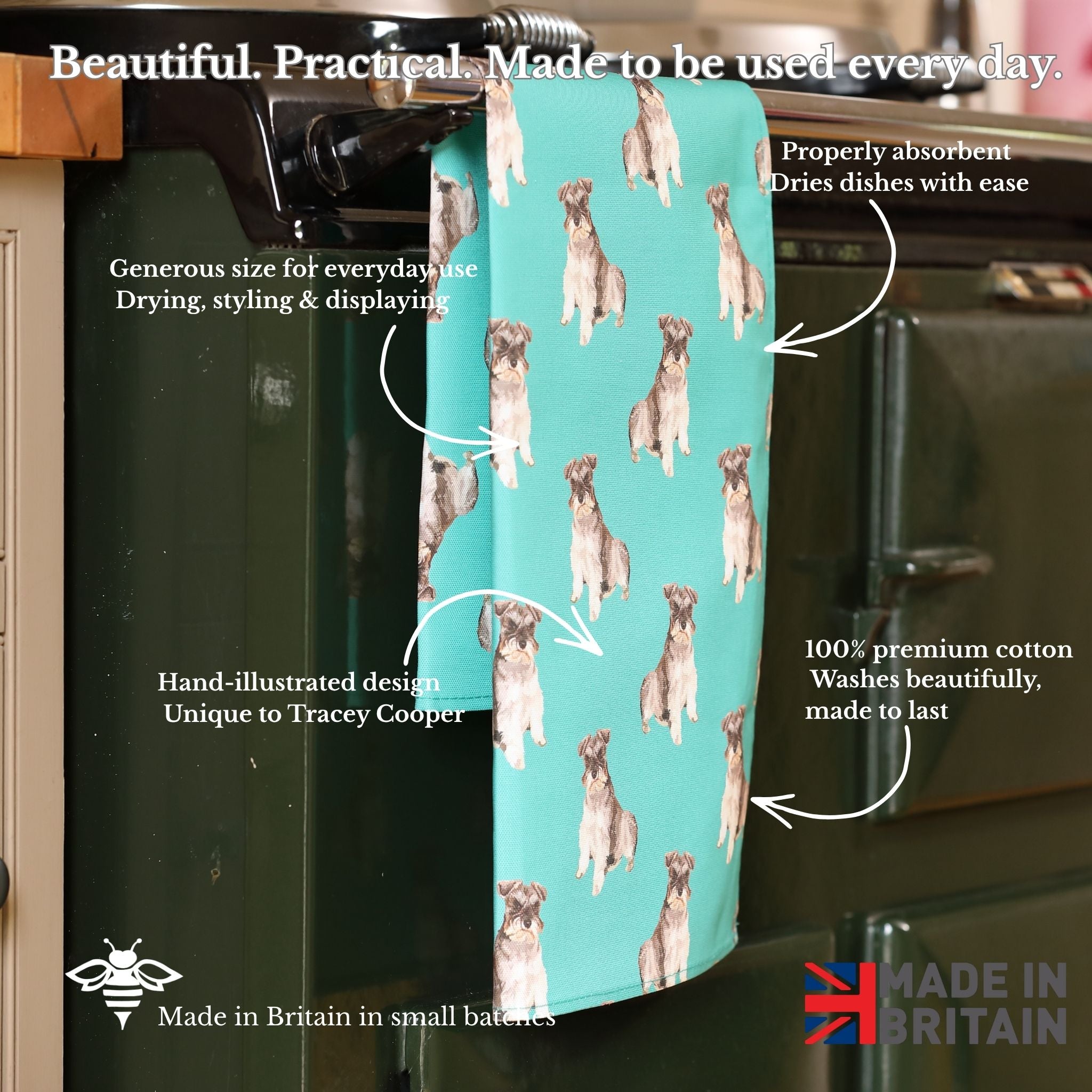Teal towel with dog pattern on a kitchen towel rack, featuring text about its features.