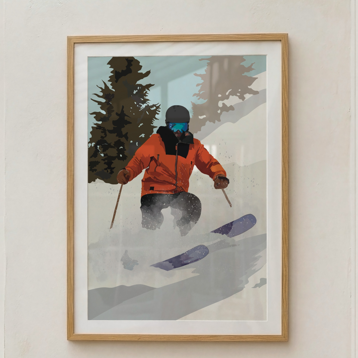 A framed art print featuring a stylized illustration of a skier in an orange jacket on a snowy mountain, displayed on a light beige wall.