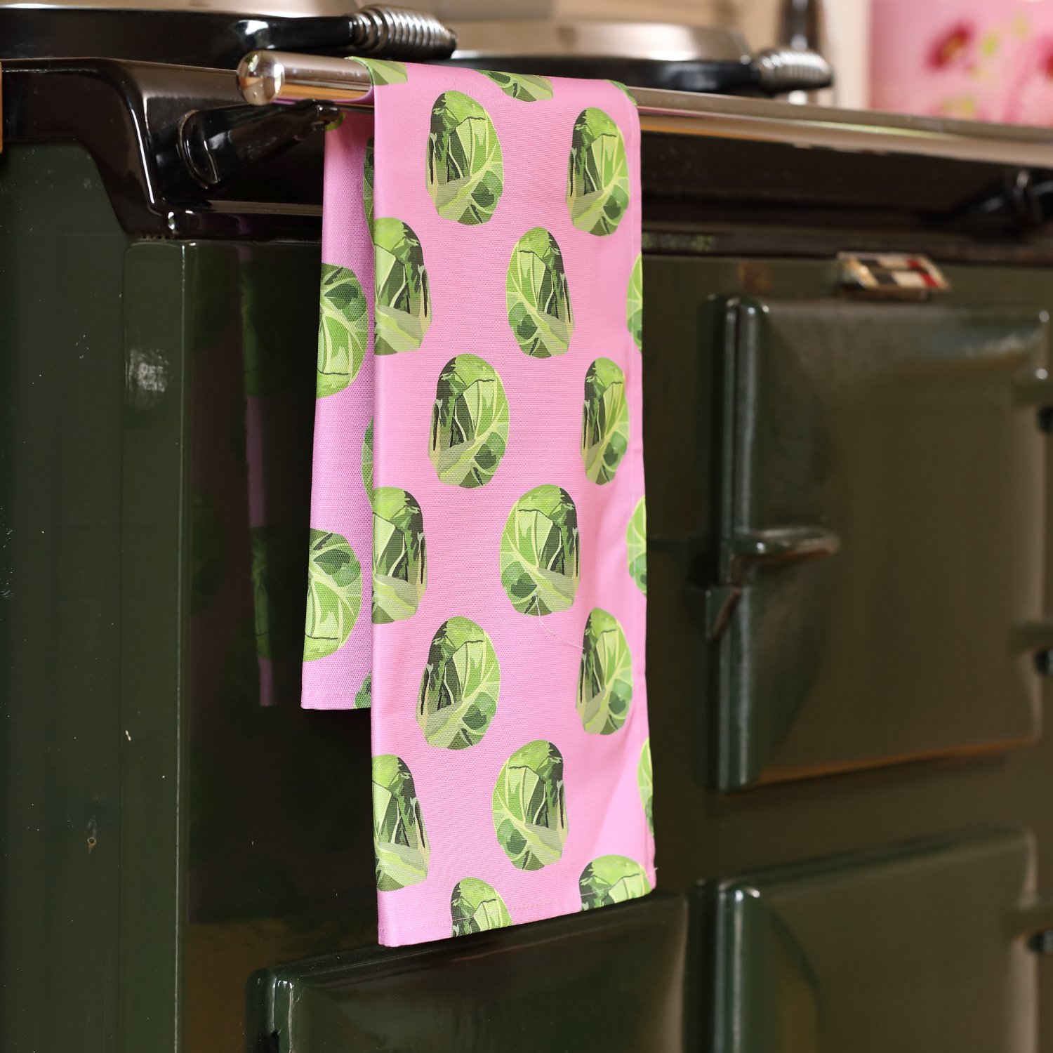 Hand-illustrated Sprout Tea Towel by Tracey Cooper — 100% cotton, printed in the UK, featuring a fun sprout design on a pink background.