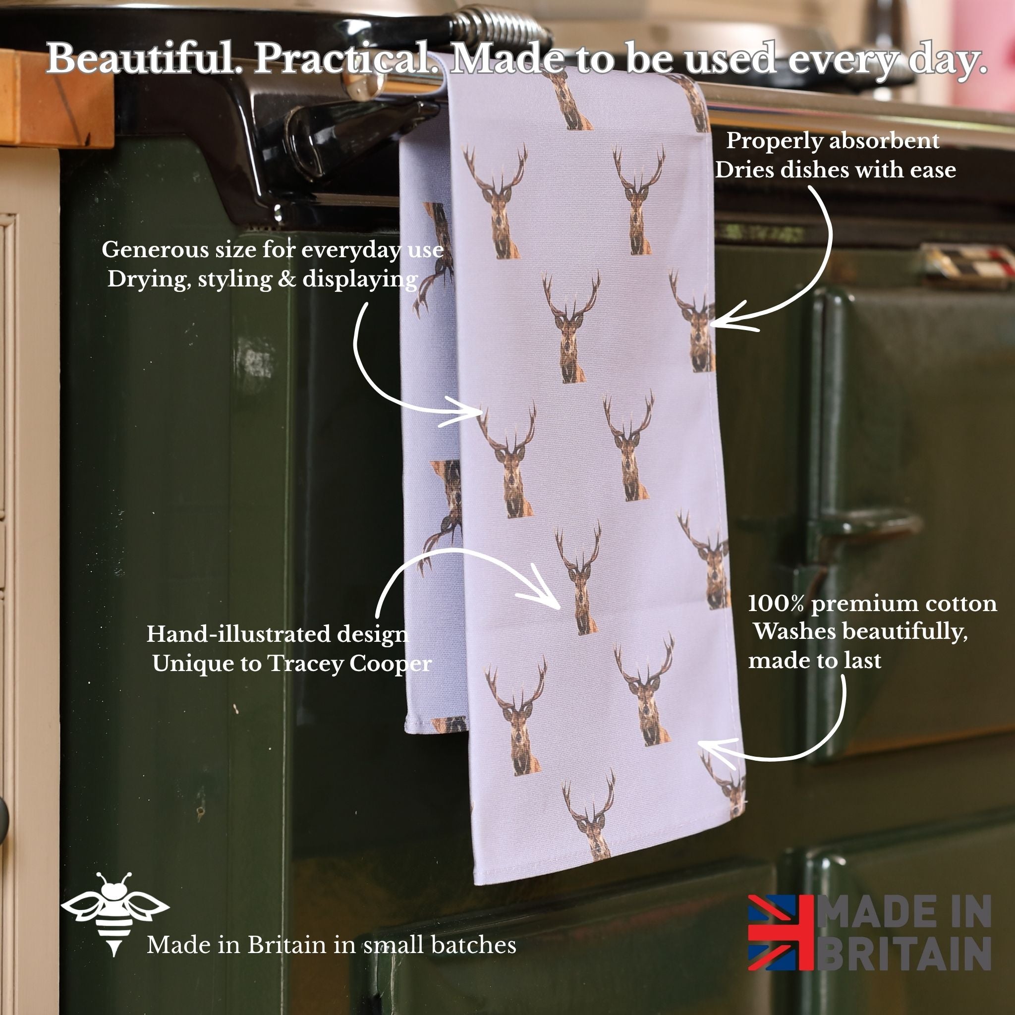 Tea towel with deer pattern hanging on a kitchen rack, with text describing its features.