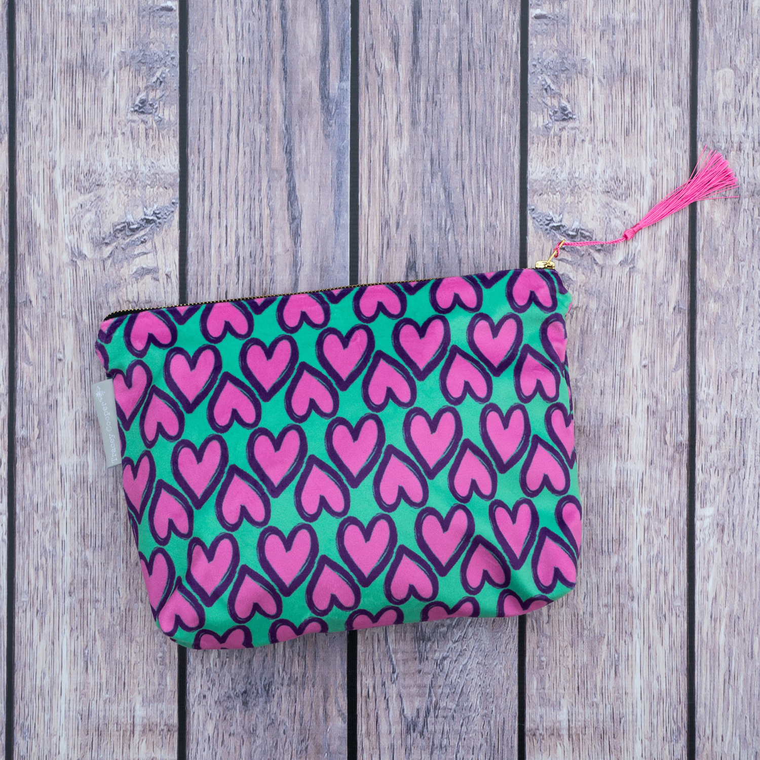 green heart make up bag with tassle