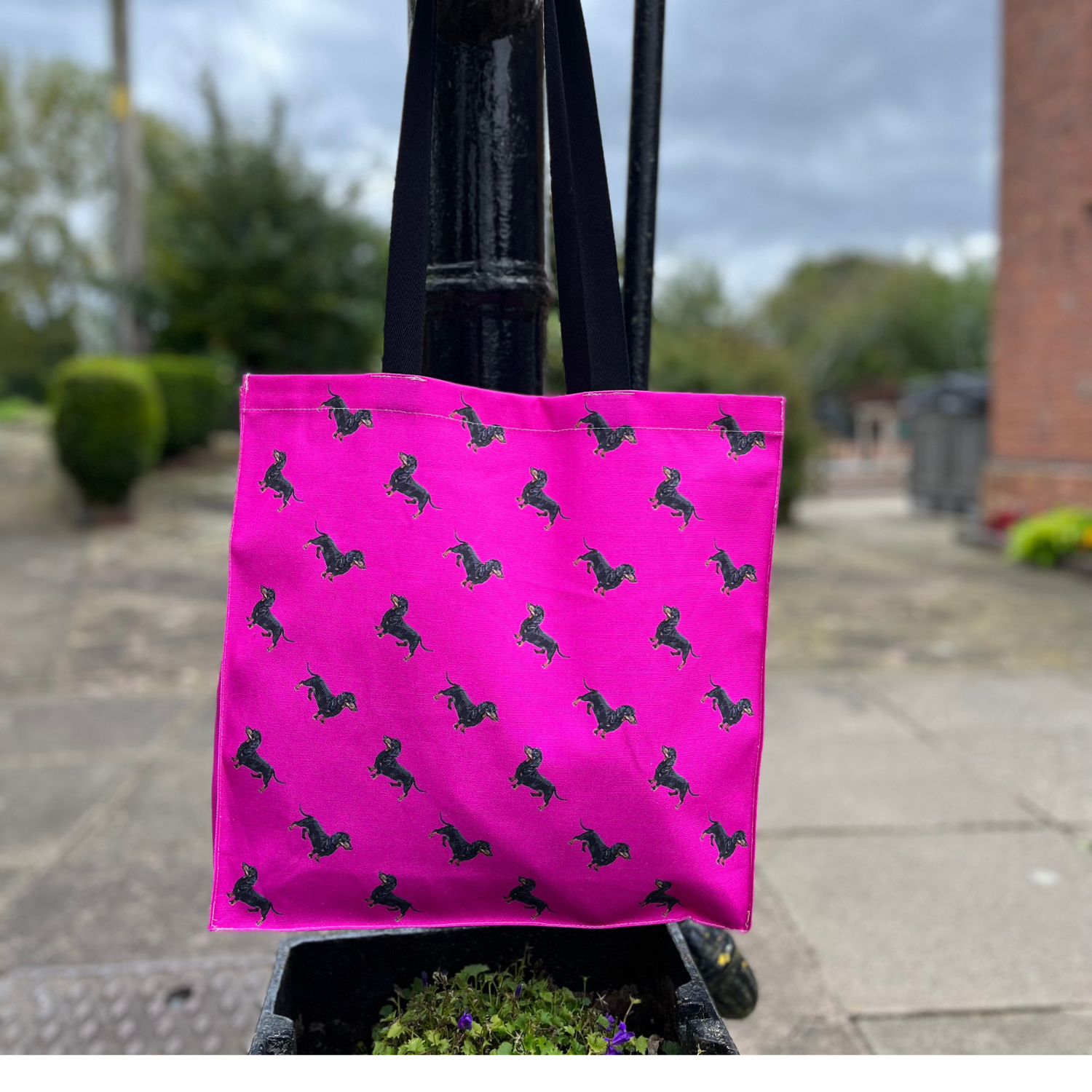Sausage dog tote bag with hand-illustrated dachshund on pink background
