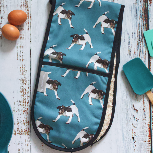 Hand-illustrated Springer Spaniel Double Oven Glove by Tracey Cooper — crafted from 100% cotton in pale blue to bring British charm into your kitchen.