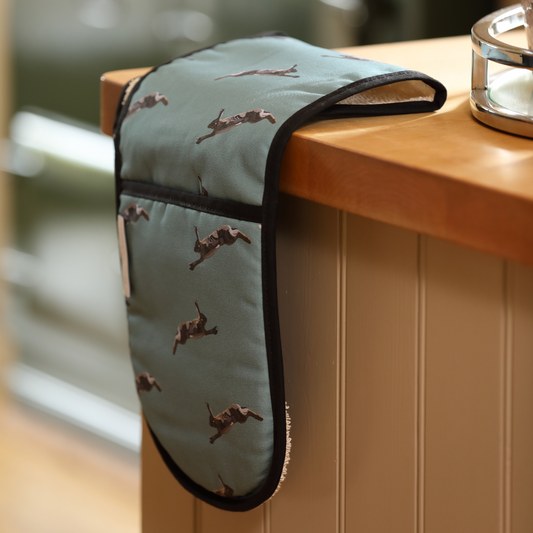 Hand-illustrated Hare Double Oven Glove by Tracey Cooper — crafted from 100% cotton in soft sage green to bring countryside artistry to your kitchen.