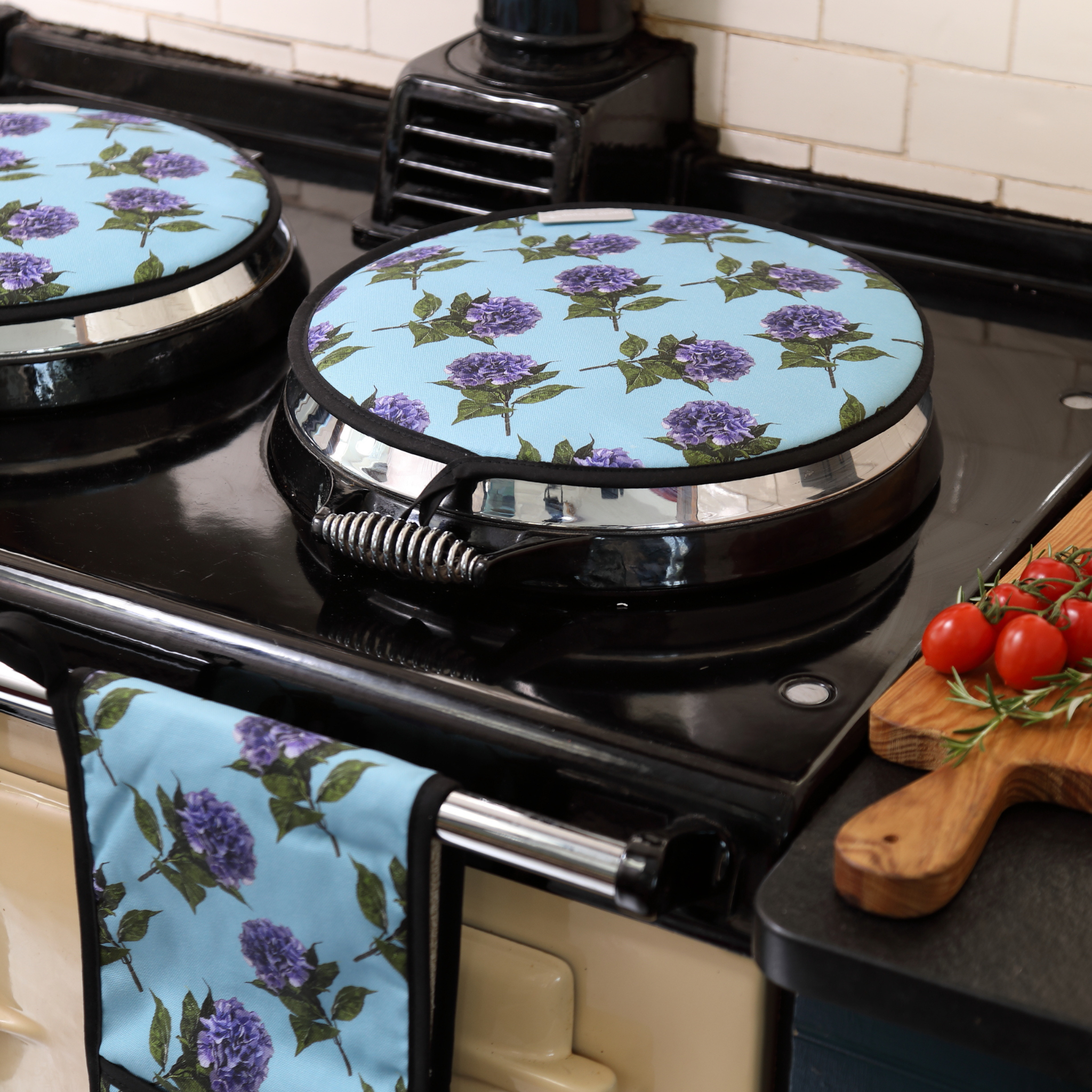 Close-up of Tracey Cooper’s blue hydrangea floral design on an AGA hob cover