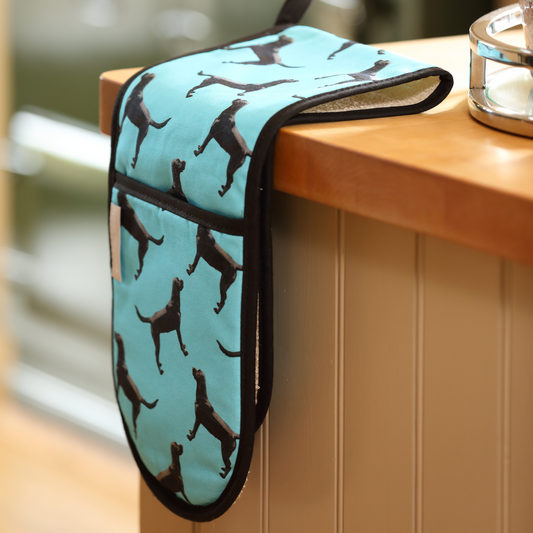 Hand-illustrated Black Labrador Double Oven Glove by Tracey Cooper — crafted from 100% cotton in blue to bring charm, warmth, and artistry to your kitchen.