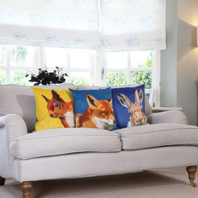 Velvet cushions on a beige sofe