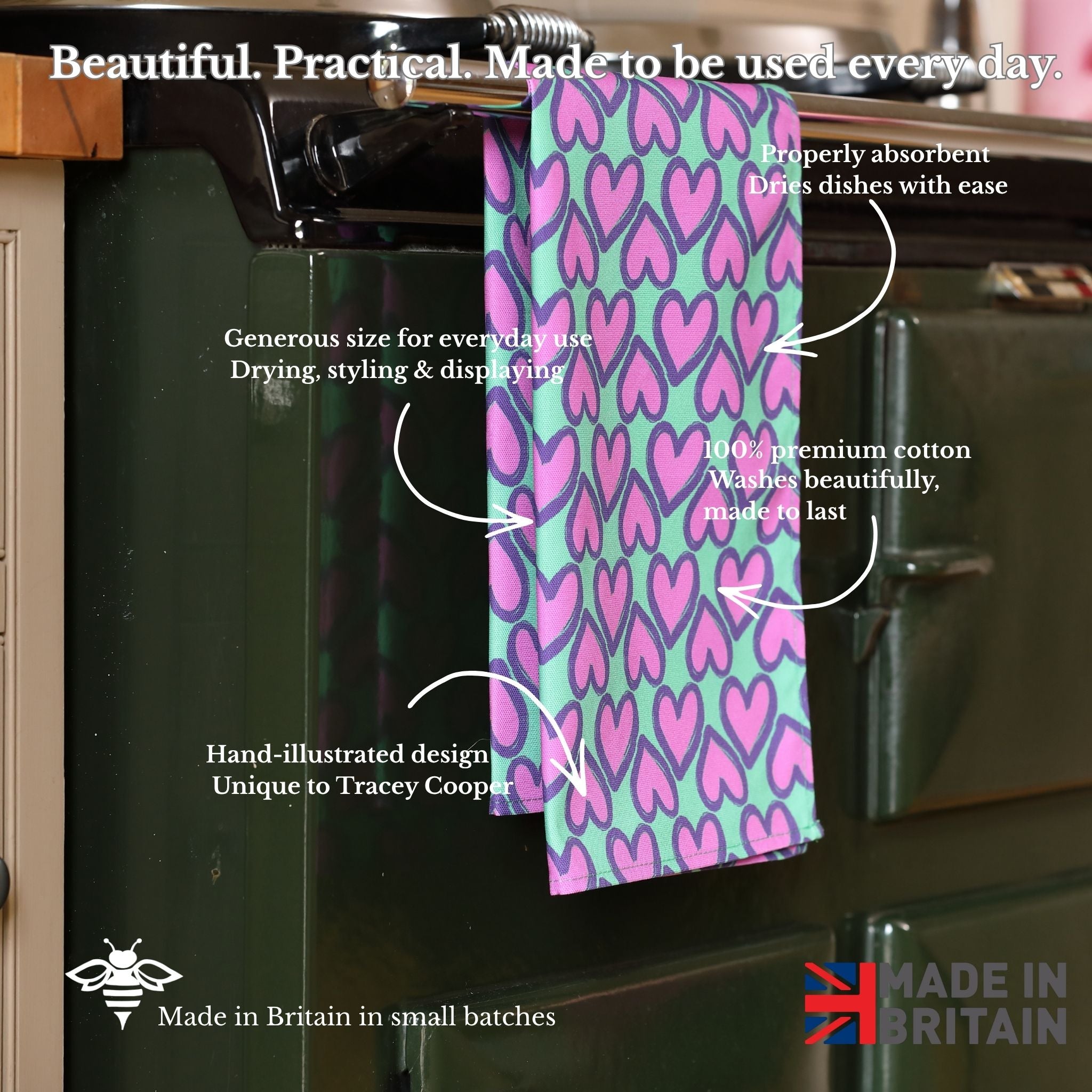 Heart-patterned towel hanging on a kitchen rack with text about its features.