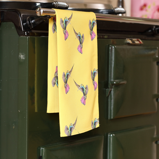 Hand-illustrated Hummingbird Tea Towel by Tracey Cooper — 100% cotton, printed in the UK, featuring colourful hummingbirds in flight.