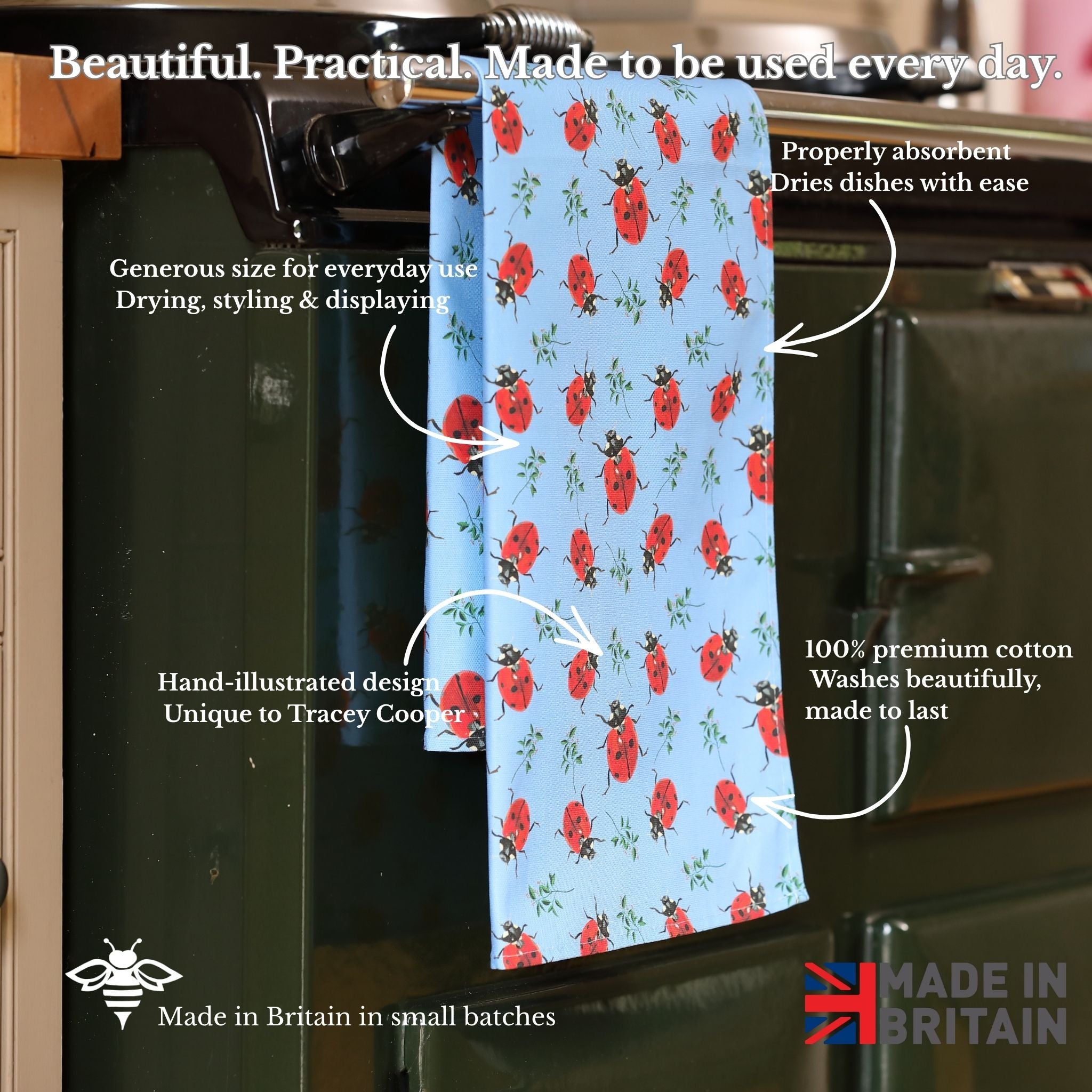Ladybird patterned towel hanging on a kitchen rack with text describing its features.