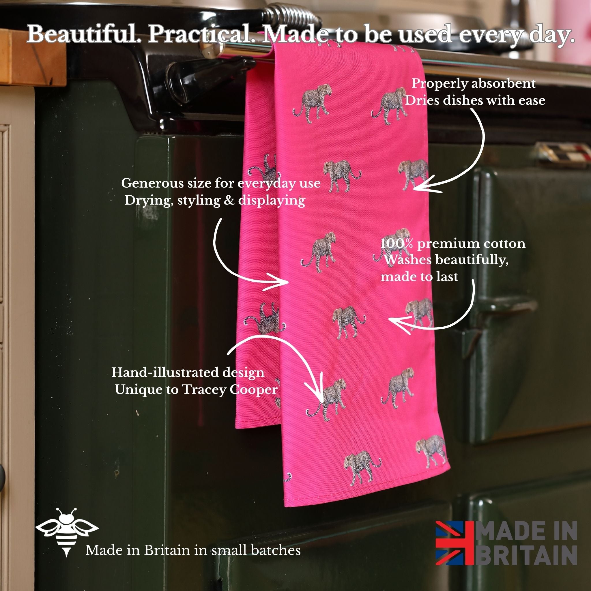 Pink towel with leopard pattern hanging on a kitchen rack, with text describing its features.