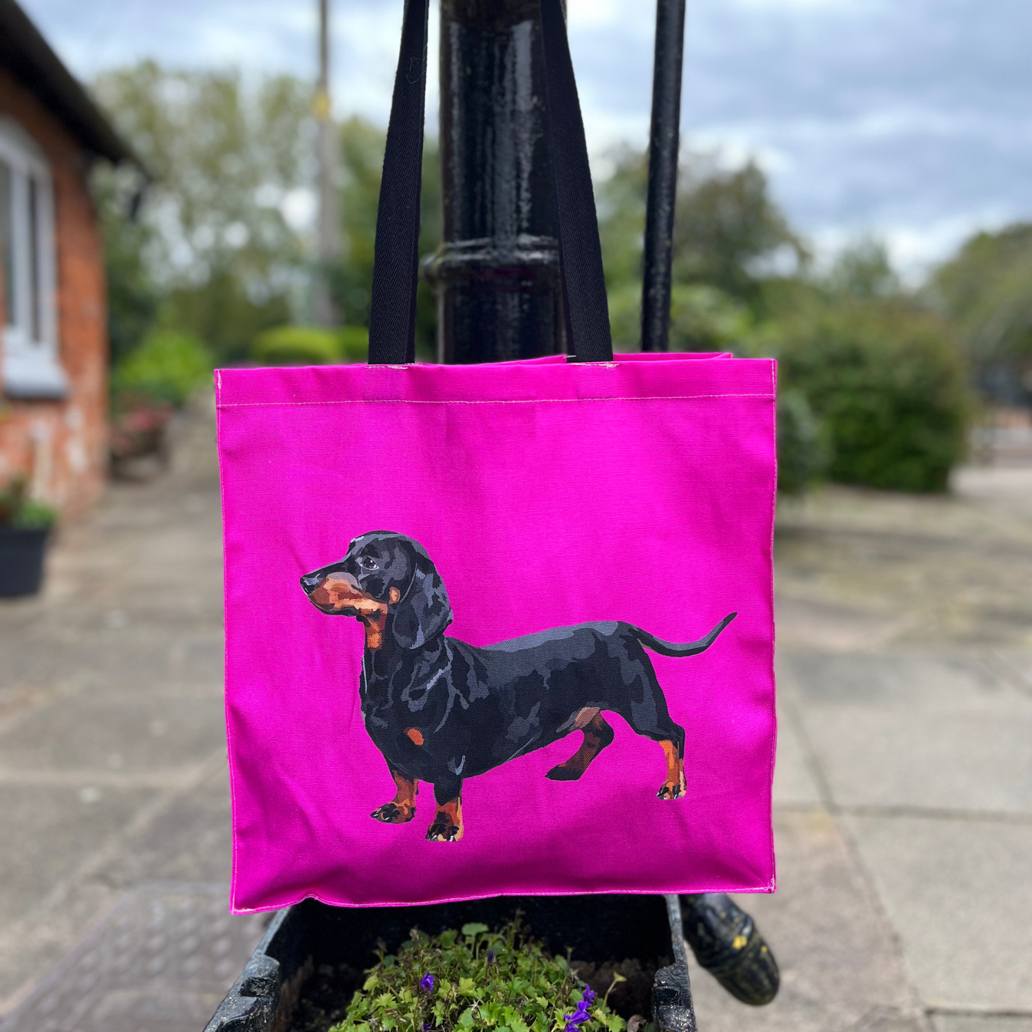 Sausage dog tote bag with hand-illustrated dachshund on pink background