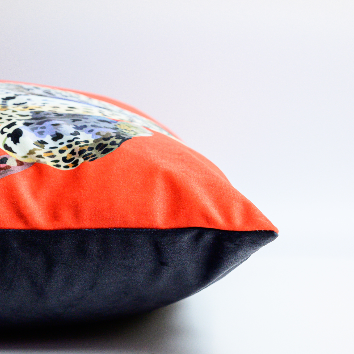 Leopard velvet cushion with hand-illustrated leopard design by Tracey Cooper side view