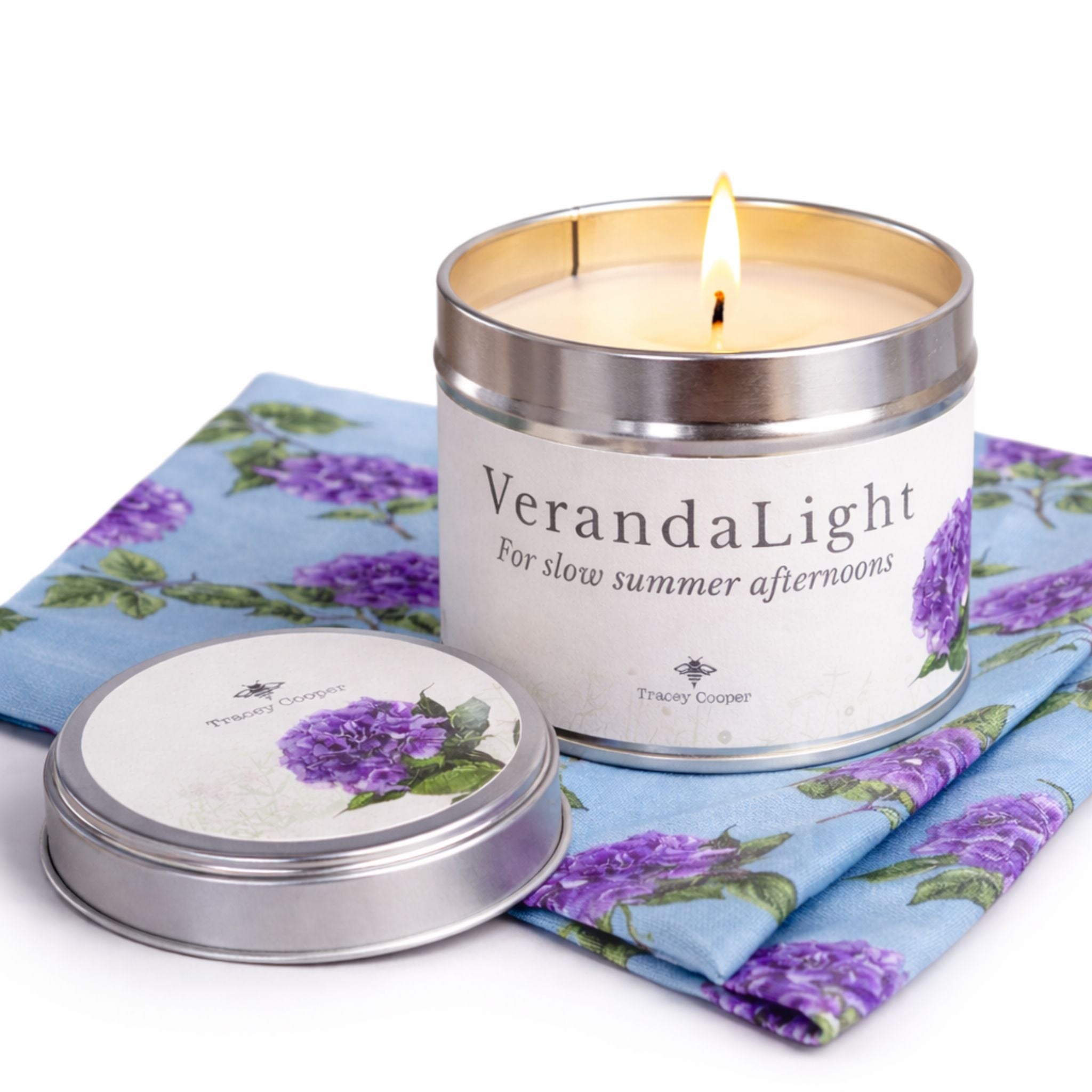 Lit VerandaLight candle with hydrangea design creating a warm summer glow