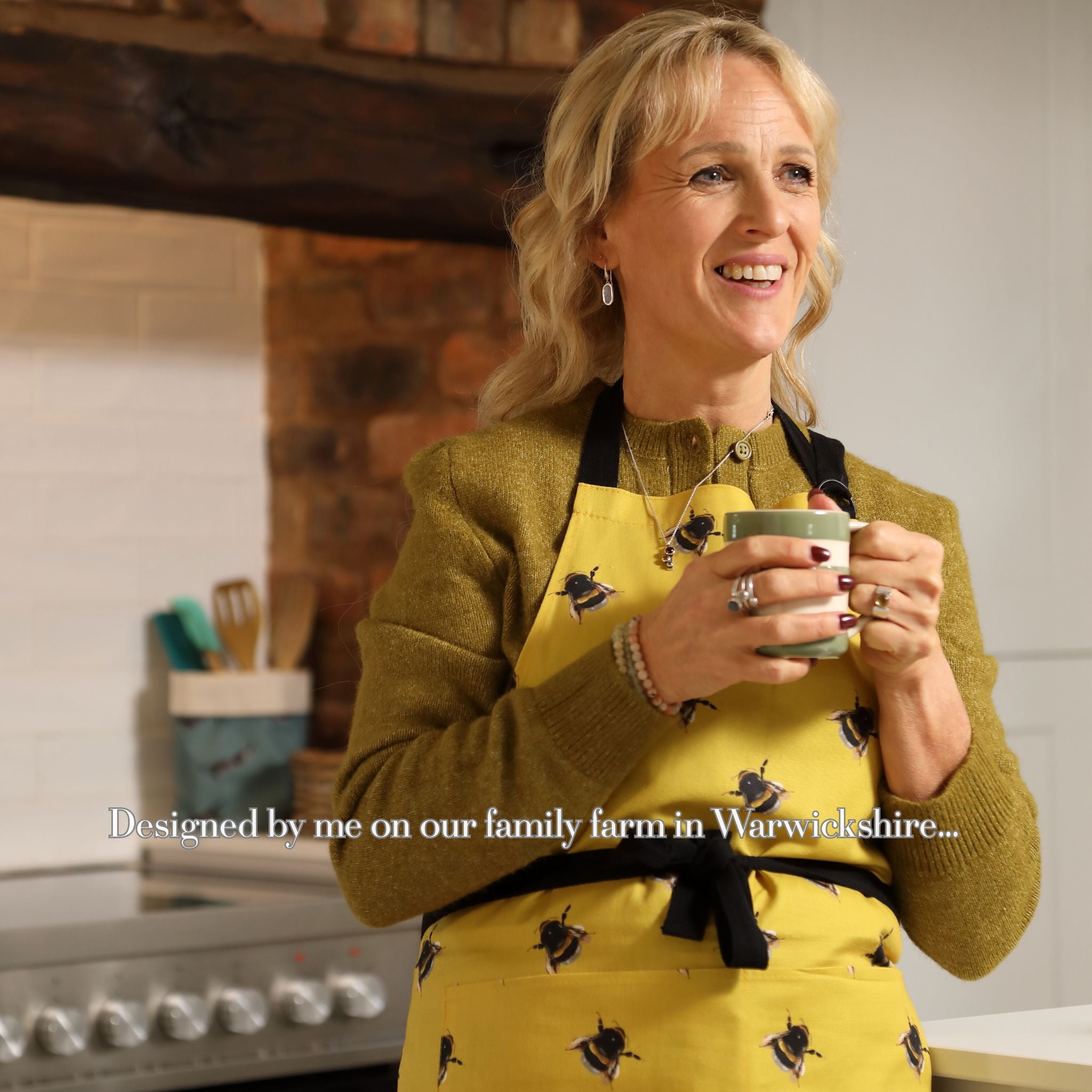 Yellow bee apron UK, hand illustrated kitchen apron, British made homeware by Tracey Cooper in farmhouse kitchen