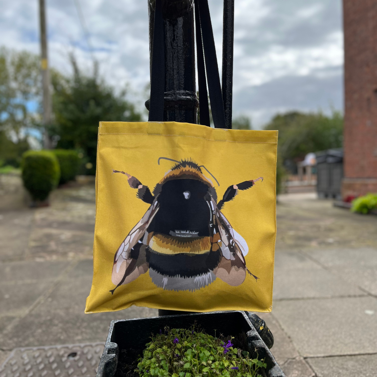 Bee tote bag with hand-illustrated bee on yellow background