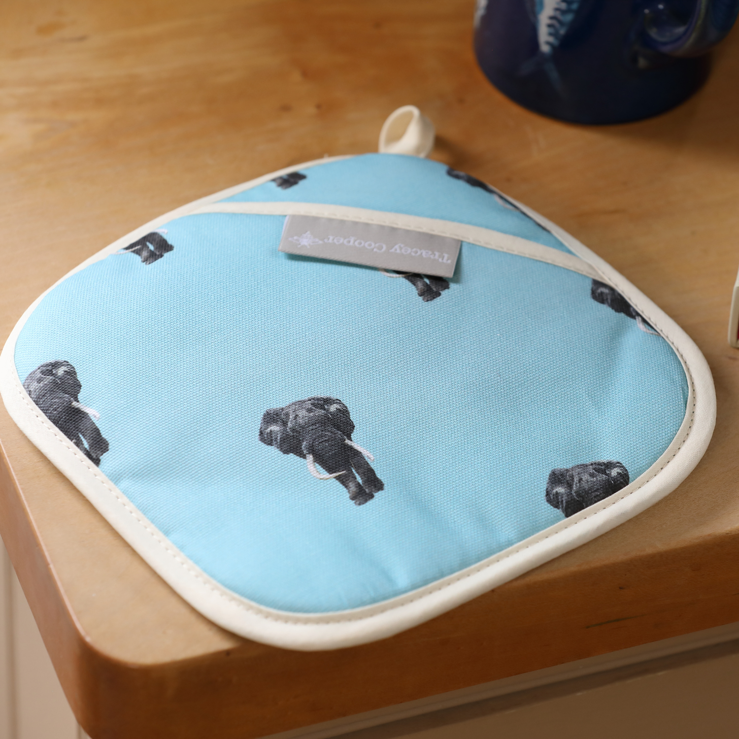 Hand illustrated bull elephant pot grab blue background