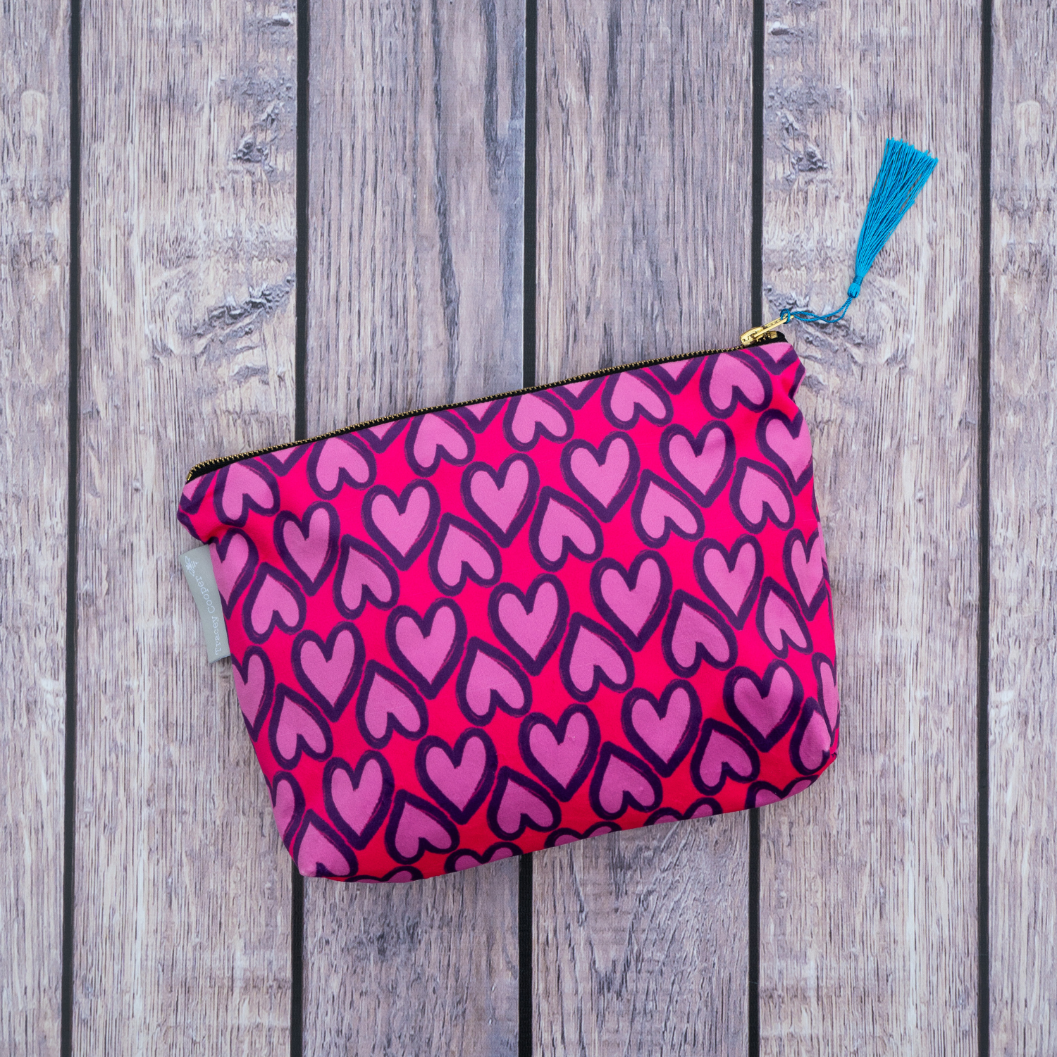 Pink hearts velvet makeup bag with hand-illustrated heart design by Tracey Cooper